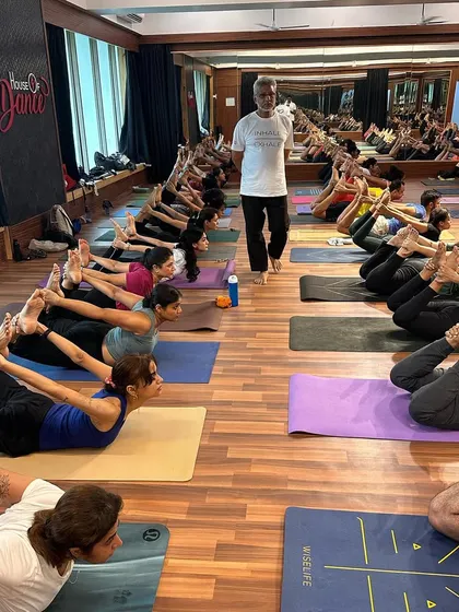 My guru, Ramendra sir, guiding students in Dhanurasana. It's a blessing to have him in our classes.