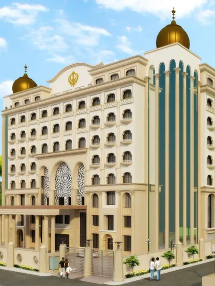 The facade of Gurudwara Anandpur Sahib, where we introduced modern elements like large glass panels alongside traditional golden domes. This project demonstrates our ability to reinterpret sacred architecture for a contemporary context while preserving its devotional essence.