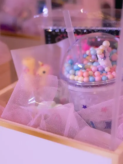 It's all about the little details. These unicorn-themed party favors, complete with custom cups and gift boxes, are an example of how I ensure every part of an event is perfectly on-theme.