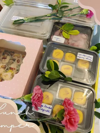 This lunch hamper is a full North Indian meal, featuring Amritsari Kulcha, Chana Masala, Dahi Vada, and sweet Mango Sandesh for dessert.