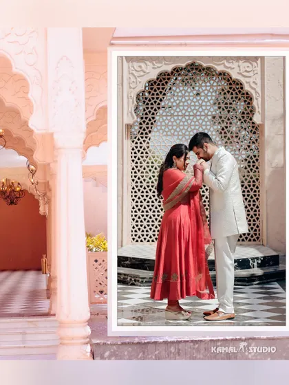 A chivalrous moment against an intricately carved 'jali' screen. The soft, pastel tones of the location and outfits create a dreamy and elegant pre-wedding portrait.