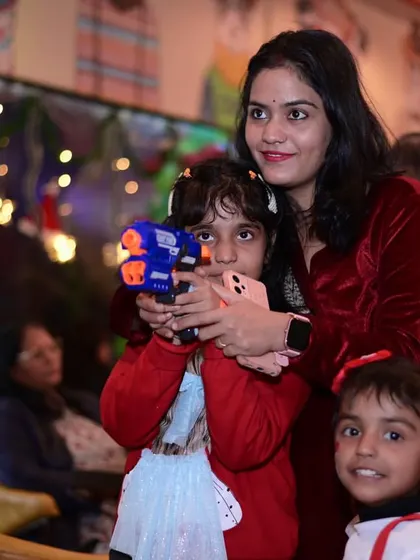 Fun and games during our Christmas party. Here, a mother and her children enjoy one of the many activities we had planned for the day.