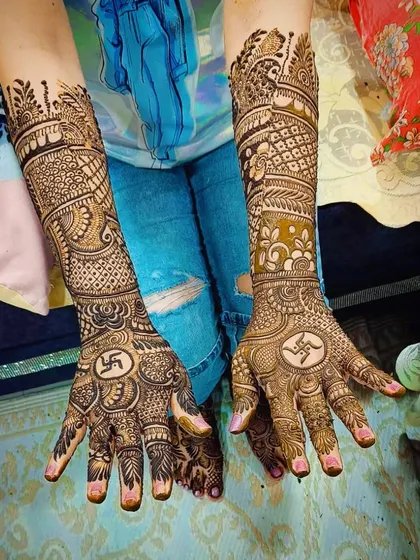 This client requested auspicious Swastika symbols on her palms. I can incorporate any spiritual or cultural symbols that are meaningful to you.