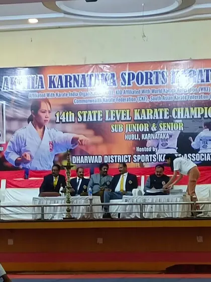 The main stage and banner of the 14th State Level Karate Championship in Hubli, where my students competed.
