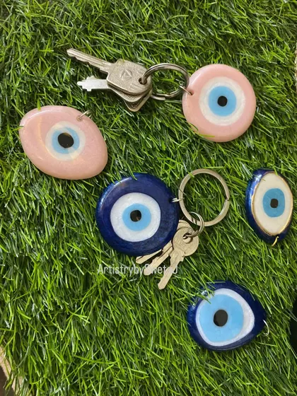 A collection of my evil eye keychains in both pink and blue, perfect for carrying positive energy everywhere you go.
