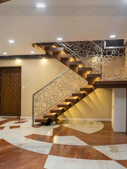 Another angle of the staircase from image 116, showing its dramatic presence in the entryway.