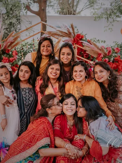 A beautiful group photo of the bride with her family and friends, a cherished memory from the Myra ceremony.