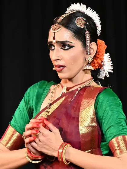 The intensity of expression on Madhura's face as she performs an abhinaya piece. This is the result of years of training in emotional storytelling.