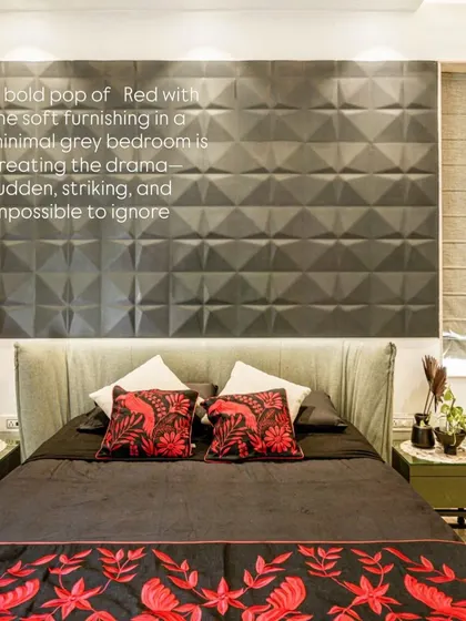 A close-up of the bed from image 13, focusing on the red floral embroidery and textured headboard.