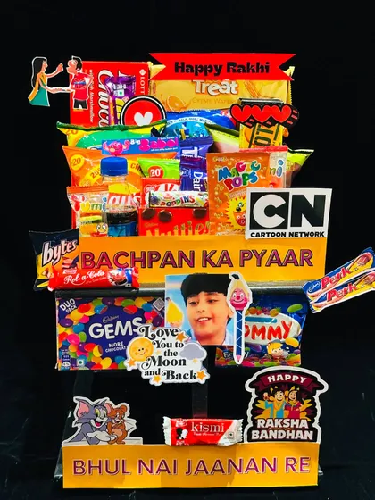 Take a trip down memory lane with this 'Bachpan Ka Pyaar' 90s nostalgia hamper. It’s filled with retro snacks and candies that will remind your sibling of your childhood days together, making it a sweet and sentimental Rakhi gift.