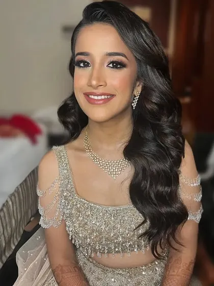 Glowing in gold for her Sangeet night. These beautiful, defined waves were the perfect choice to complement her radiant makeup and sparkling outfit.