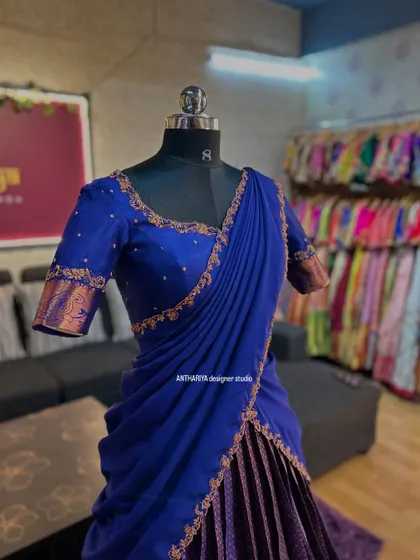 A rich royal blue and deep purple langa voni displayed in the studio. The contrast is striking and perfect for evening functions.