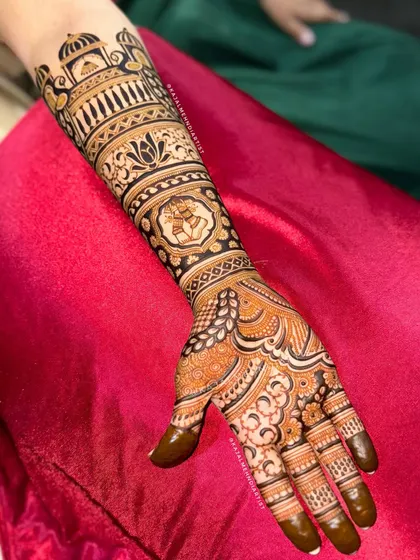 The full arm design for the dancer bride, with intricate patterns and the ghungroo motif taking center stage. A truly unique and custom bridal design.