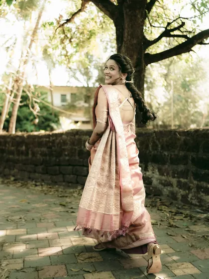 A playful, over-the-shoulder glance from the bride as she walks away, full of joy.