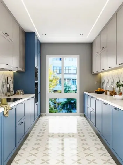 This parallel kitchen uses a calming blue and white color scheme. The patterned floor tiles add personality, and the large window at the end brings in plenty of natural light.