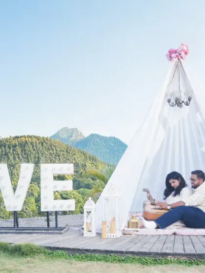 A romantic anniversary shoot with a 'LOVE' marquee and a bohemian-style tent. We help you celebrate your milestones with beautifully styled photoshoots.