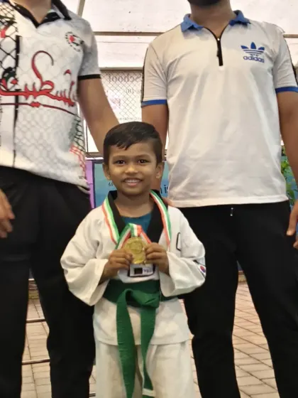 Uzaif proudly holding his gold medal. This young warrior has a bright future ahead of him in Taekwondo.