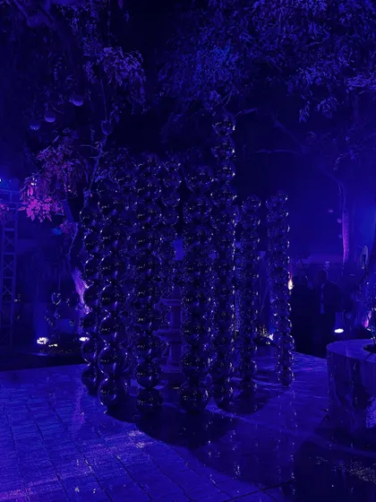 The dramatic, purple-lit stage design for the "Disco" show, featuring towers of reflective spheres.