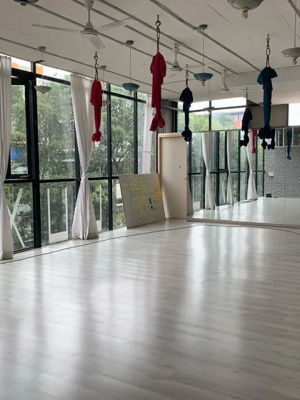 Our second studio, equipped with aerial hammocks and large windows. This is where we fly, stretch, and find new perspectives.
