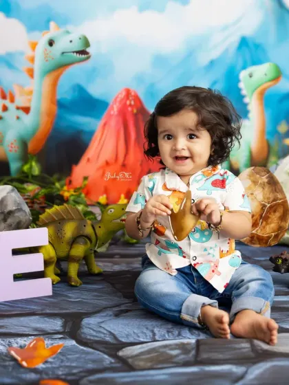 Roar. This dinosaur theme is a new favorite. It's perfect for a 'rawr-some' first birthday, with a friendly volcano, cute dinosaurs, and a prehistoric backdrop.