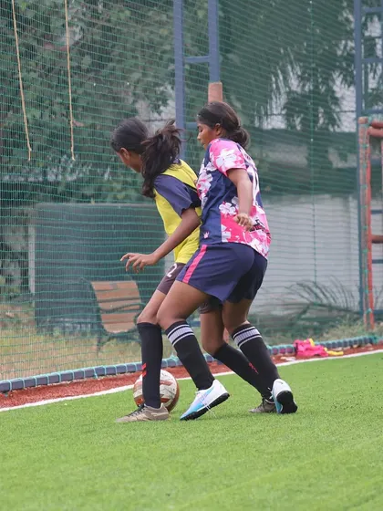 An intense moment from the TGIF x She Kicks Football League, as our player shields the ball from an opponent. This shows the physical and technical battle in every match.