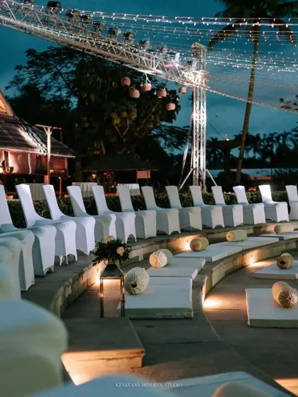Lighting is key to creating atmosphere. For this Sangeet, we used a canopy of fairy lights and spotlights to transform an outdoor amphitheater into an iconic, concert-like venue for the night's celebrations.