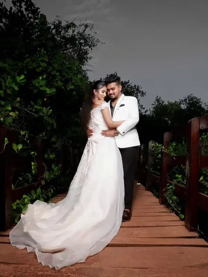 An intimate pose from the same photoshoot. The lighting highlights the details of her gown and his sharp attire, all coordinated by me for a perfect picture.