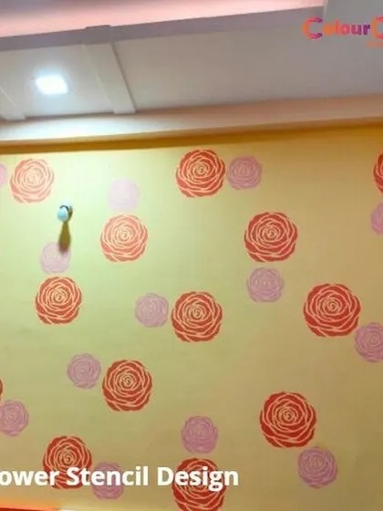 A simple and sweet flower stencil design in shades of pink and orange. This scattered pattern adds a touch of whimsy and color, ideal for a bedroom or any space needing a cheerful lift.