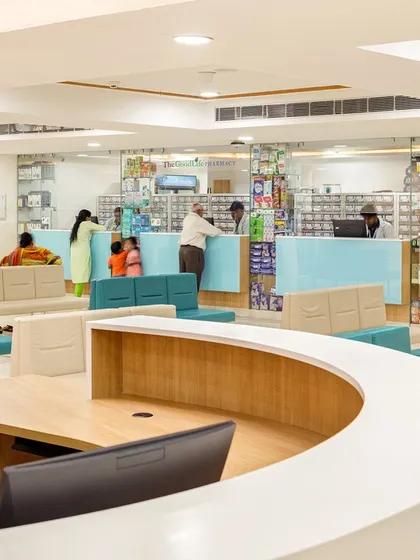 The reception and waiting area at Sarvodaya Hospital, a repurposed commercial building, is designed for efficiency and comfort. The layout accommodates a high volume of patients while maintaining a sense of order and calm.