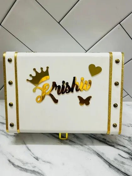This elegant white and gold leatherette trunk box can be personalized with any name, making it a perfect storage box for jewelry, letters, or other special items.