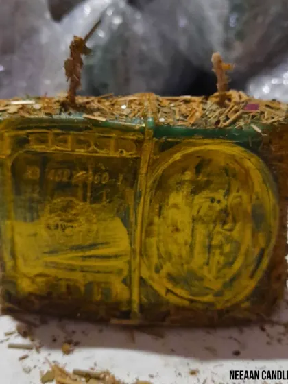 This is a powerful money candle, designed to look like a stack of currency and covered in herbs to manifest abundance. Light it with focus to attract prosperity and financial success.