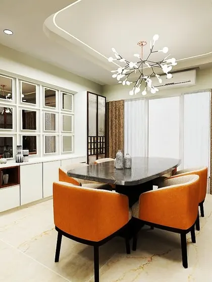 An elegant dining space featuring a custom crockery unit with mirrored shutters. The design adds a touch of glamour and also helps to make the space feel larger and brighter.