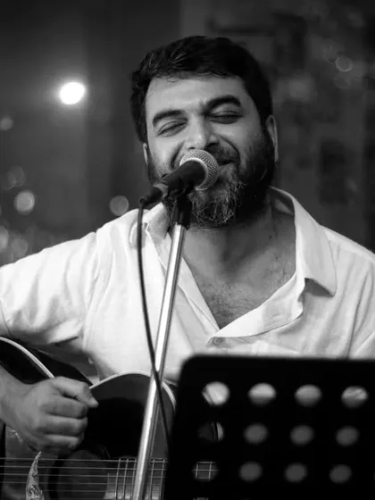 The pure joy of performing. This black and white shot captures the happiness and passion of a musician sharing his art with the world.