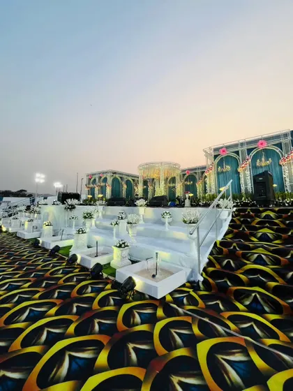 A breathtaking view of a grand reception stage I designed. Notice the multi-level platform, integrated water features, and the striking custom carpet that all come together to create an unforgettable backdrop for a special day.