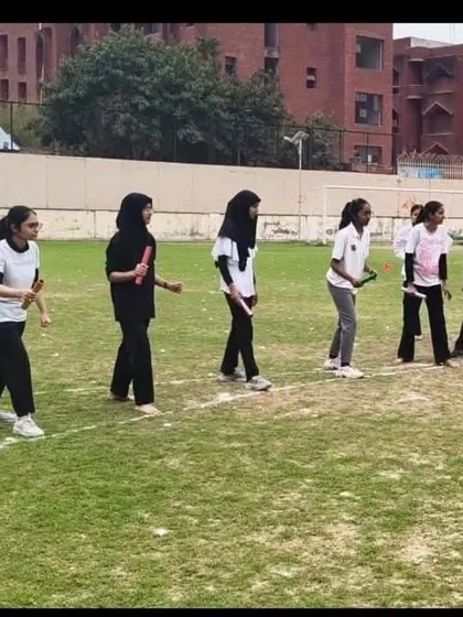 Teamwork in action during the relay race at the Girls' Hostel Annual Sports Meet. These events foster both competitive spirit and camaraderie among students.