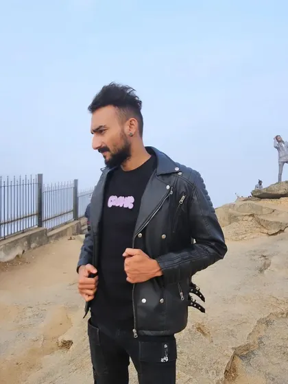 The landscape behind me is vast and open, representing the endless possibilities in music.