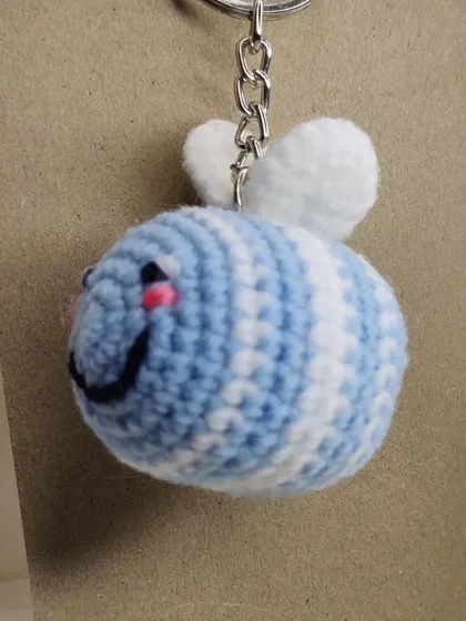 The blue bee charm, ready to hang.