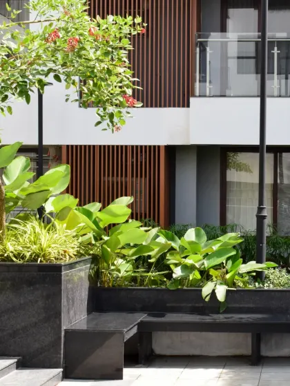A close-up of the landscape design at Sona Vistaas, showing how planters and benches redefine the edge between built and unbuilt, enhancing both visual comfort and usability.