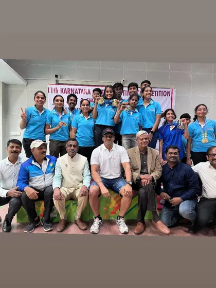 A group photo with all our medal winners and supporters at the 11th Karnataka State Shooting Competition, celebrating our overall success.