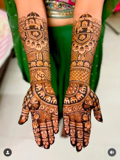 A mirror image of the previous design, showcasing the symmetry and precision of the elephant and initial motifs.