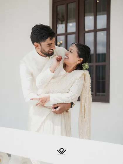 A sweet and playful embrace between a couple, showcasing their easy and natural chemistry.