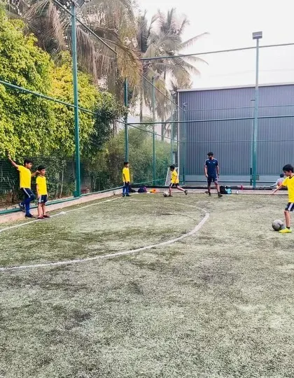 A player dribbles the ball during a practice session. We provide ample space for kids to practice their skills in a game-like environment.