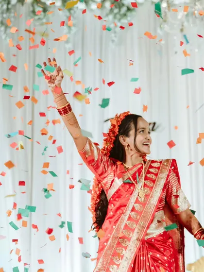 A shower of confetti marks a moment of pure celebration for the bride. It's these picture-perfect, high-energy moments that make a wedding reception unforgettable.