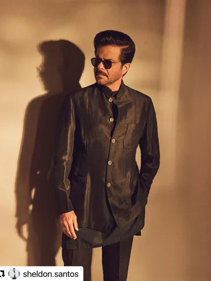 The side profile of Anil Kapoor's haircut shows the clean lines and expert styling.