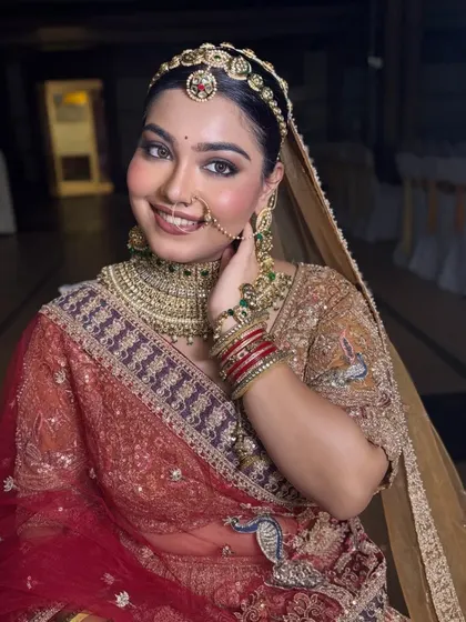 A happy, smiling bride. The soft glam makeup with a nude lip ensures that her natural joy and beauty are the main focus.