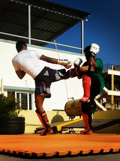 Executing a clean head kick during a rooftop sparring session. We teach students how to set up and land these techniques safely and effectively.