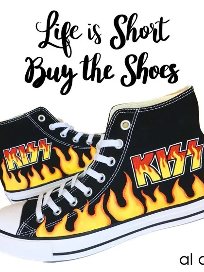 These black Converse high-tops were customized for a fan of the band KISS. I hand-painted the iconic band logo surrounded by vibrant flames for a classic rock and roll look.