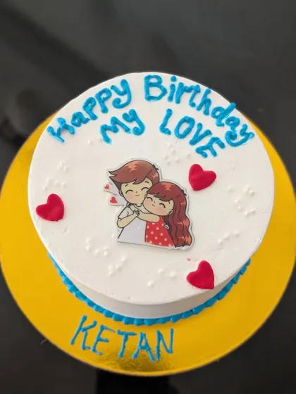 A sweet and simple cake with an edible print of a cute cartoon couple. It's a lovely way to say "Happy Birthday My Love".