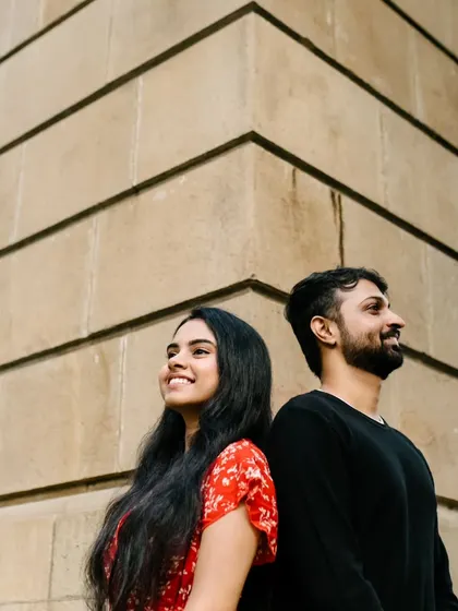 A simple, happy moment captured in the warm afternoon light. This candid shot shows their bright smiles and easy connection, which is the essence of my couple photography.