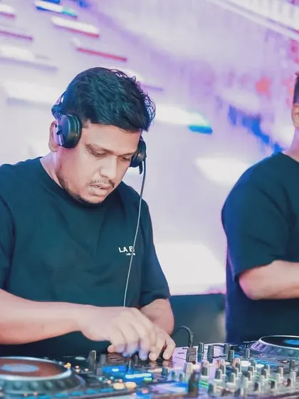 Focused and working in sync with my VJ. We work as a team to ensure the visuals on the screen match the energy of my music perfectly.